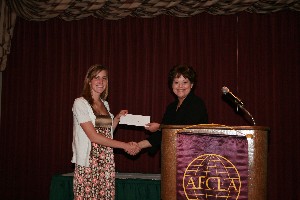 Justinn Hamby (l), Edmond North High School, receives a scholarship award from Renee Fairley, chapter vice president for special projects, during the May luncheon.